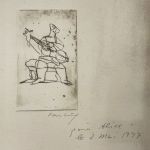 SEATED FIGURE WITH GUITAR