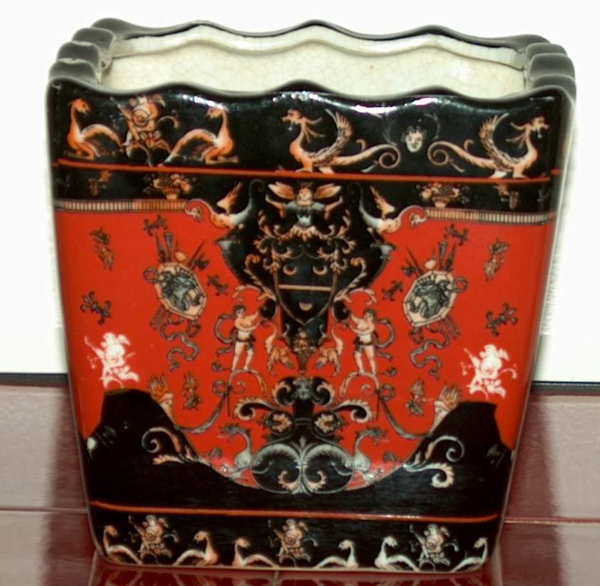 CHINESE JARDINIERE DECORATED IN RED AND BLACK