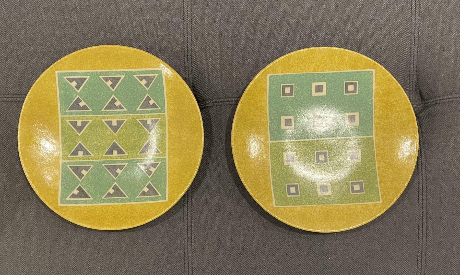 PAIR OF YELLOW PLATES WITH GEOMETRIC DESIGNS