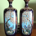 PAIR OF SMALL VASES WITH FLORAL DESIGNS IN MIRROR IMAGES